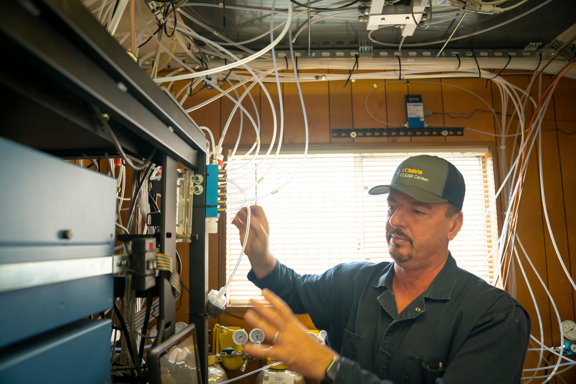 Frank Mitloehner working with gas analyzers at UC Davis