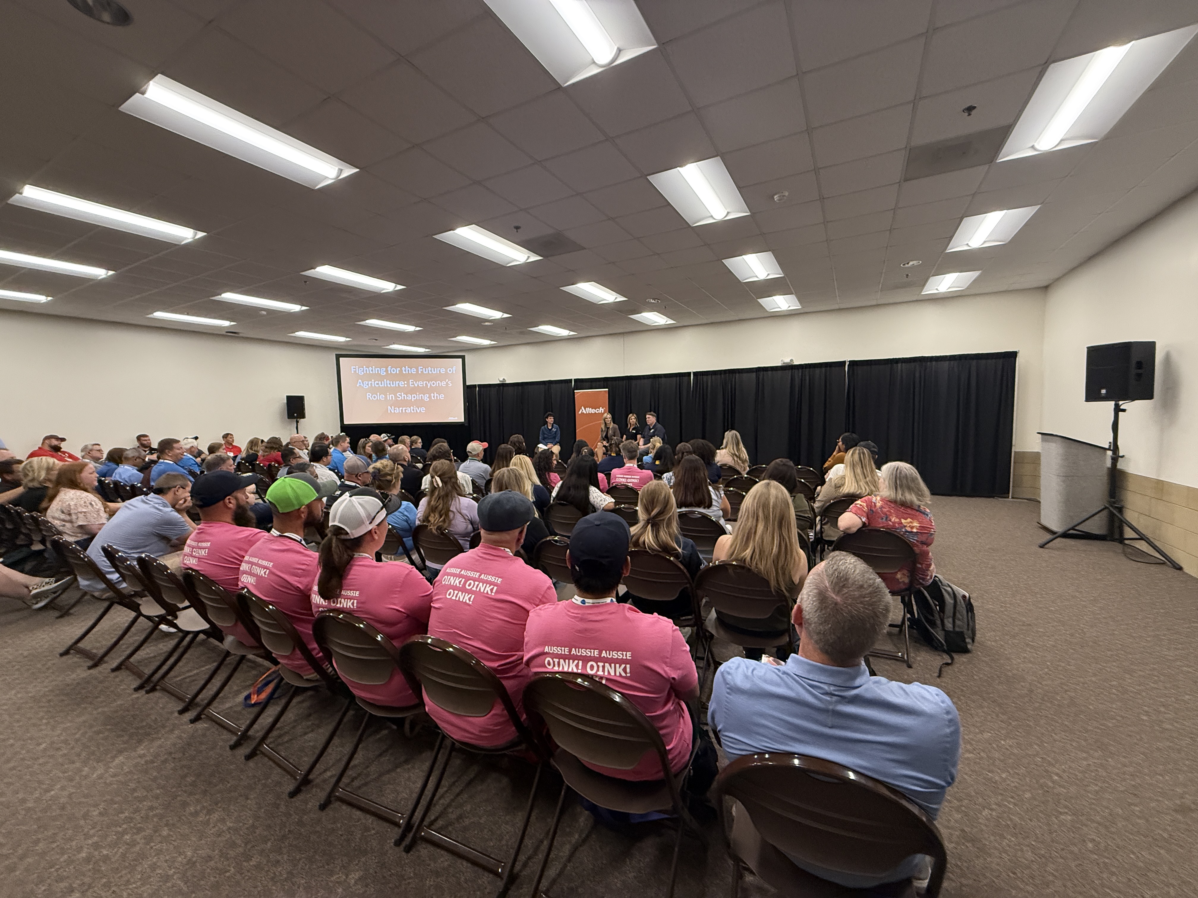 A packed room listens to a panel discussion at the World Pork Expo