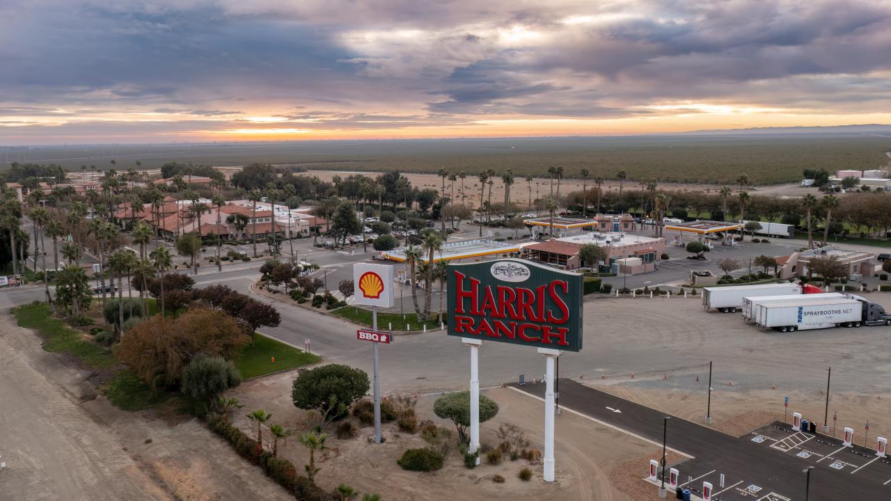 An aerial view of Harris Ranch with a large Harris Ranch sign in the middle of the picutre