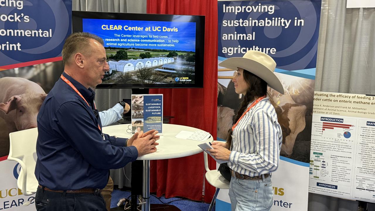 Dr. Frank Mitloehner speaks with a guest at the Cattle Con event