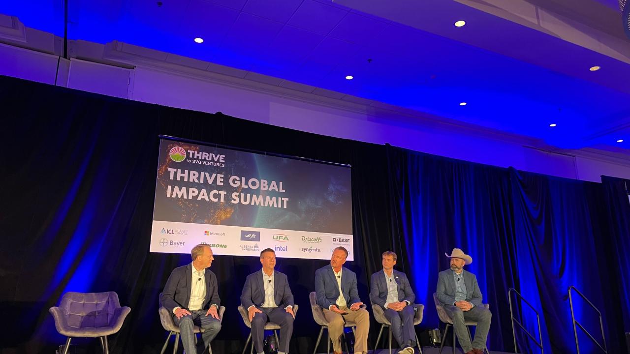 A panel discussion on stage at the Thrive Global Summit