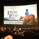 A movie screen with the words "You just can't see them from the road" is displayed on the screen