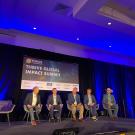 A panel discussion on stage at the Thrive Global Summit